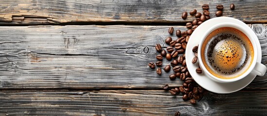 Canvas Print - Top view of a cup of coffee with coffee beans on a rustic wooden table featuring a visually appealing and versatile copy space image