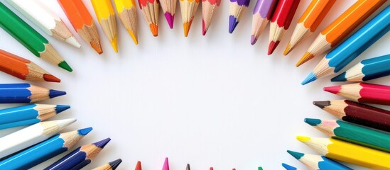 Aufkleber - Colorful pencils and school supplies arranged in a frame on a white background with room for text or images. Creative banner. Copyspace image