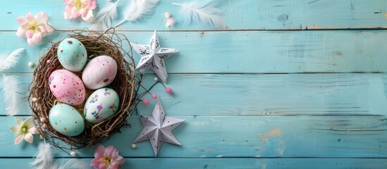 Fototapete - Celebrate Easter with a vibrant display of Easter eggs in a nest accompanied by a paper star flower and feather on a pastel colored bright blue and white wooden backdrop ideal for a copy space image