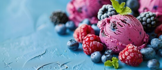 Aufkleber - A blue backdrop displays a colorful ice cream serving topped with blueberries blackberries and raspberries Copy space image