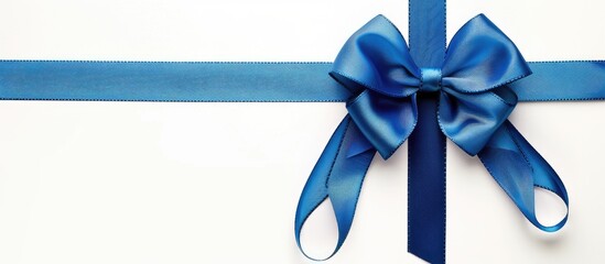 Aufkleber - Blue gift bow and cross ribbon on white background with copy space image