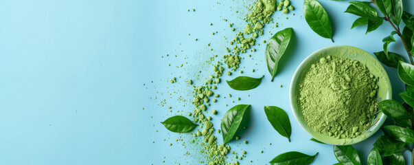 Wall Mural - Mockup of matcha tea powder with leaves on a light blue background, offering a calm and refreshing design with space for text or graphics.