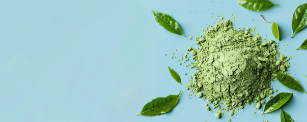 Wall Mural - Mockup of matcha tea powder with leaves on a light blue background, offering a calm and refreshing design with space for text or graphics.