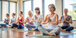 © Anhen Design - A serene yoga class with women practicing Sukhasana meditation. The group is seated in a peaceful environment, focusing on mindfulness and inner peace
