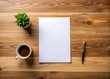 © Caitlin - Minimalist wooden desk with a crisp blank sheet of white paper, awaiting creative expression, surrounded by ample space for notes and ideas to flow freely.