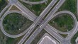 © Wirestock - Aerial view of a highway interchange with looping roads and green spaces in Cambridge, Canada