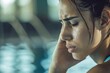 © LukaszDesign - Stress, headache, or face of woman swimmer when exercising, anxious, or exhausted. Tired, tired, or sick athlete with sport injury, migraine, or head ache upset by training