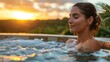 © Dionisio - A woman is in a hot tub, smiling and enjoying the sunset