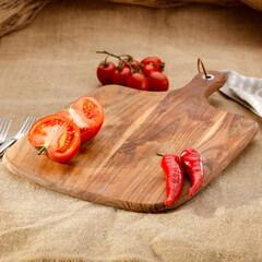 Sticker - Table background with copy space for products on wooden cutting board on wooden table with jute material tablecloth. Image montage objects display.