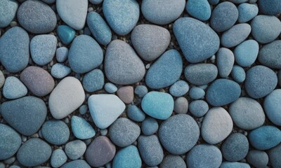 close-up of a collection of various colored pebbles or stones, arranged in a pattern.