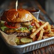 © Tipakorn - A gourmet cheeseburger with lettuce, tomato, cheese, and pickles, served with a side of crispy golden french fries on a metal tray.