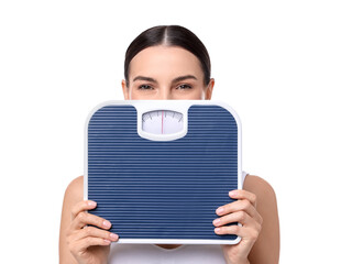 Wall Mural - Diet and weight loss concept. Young woman with floor scale on white background