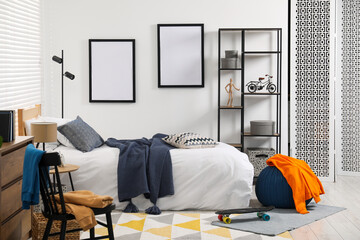 Poster - Teen's room interior with modern furniture and empty frames on wall