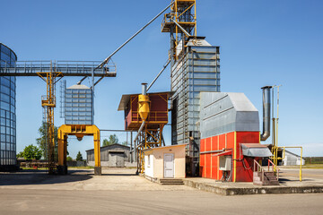 Wall Mural - silos on agro-industrial complex with seed cleaning and drying line for grain storage. Granary elevator