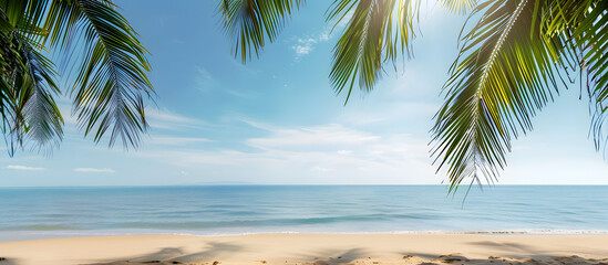 Wall Mural - Tropical beach scene with palm tree border against the backdrop. Copy space image available.