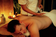 © InfiniteFlow - Masseur hands pouring aroma oil on man back. Masseuse prepare oil massage procedure for customer at spa salon in luxury resort. Aroma oil body massage therapy concept. Quiescent