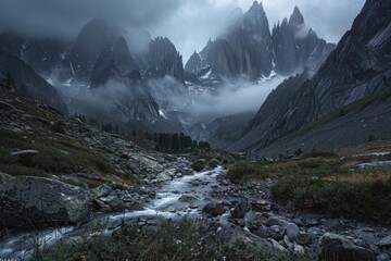 Canvas Print - A serene stream flows through a rugged mountain valley with rocky terrain and lush greenery