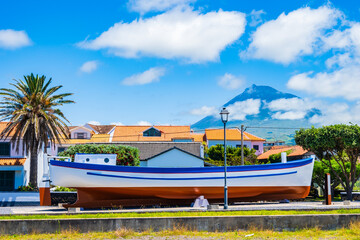 Wall Mural - Fishing boat on square of Madalena village, Pico island, Azores, Portugal