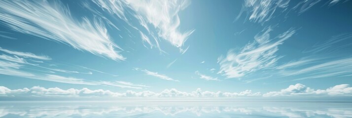 Wall Mural - a wide-angle photograph of a vast, clear blue sky with wispy clouds. the image has a clean, minimali