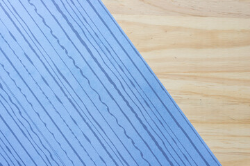 Poster - blue scrapbooking paper with wavy lines on wood