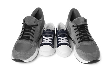 Wall Mural - Big and small sneakers isolated on white