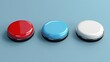 © Олег Фадеев - Three large, round buttons with a metallic rim, each in a different color: red, blue, and white. The buttons are placed in a row on a smooth, light blue surface