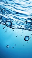 Wall Mural - Water surface with air bubbles. Water texture. Water Drops. Water splash with bubbles on blue background. Copy space for text. Water wave and air bubbles in blue water background. Copy space.