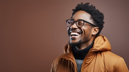 Wall Mural - Smiling Man in Orange Jacket With Glasses