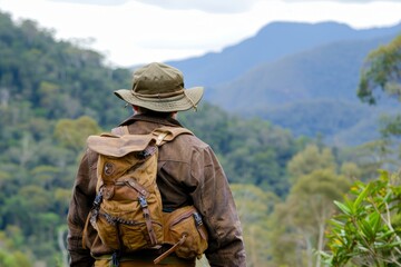 Wall Mural - Hiker Overlooks Scenic Mountain Landscape During Adventurous Trek in Nature