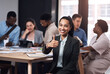 © HockleyM2/peopleimages.com - Business, woman and thumbs up portrait in workplace, hands gesture and good feedback for start up company. Approval, agree and smile for happiness, thank you and confidence in office success