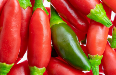 Set of small red chillies, one green isolated.Use for image background.