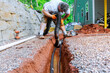 © ungvar - Laying assembling is drainage pipes for outflow of rainwater stormwater in trench underground