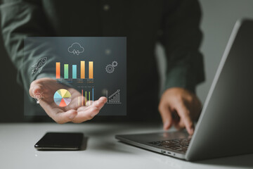 Aufkleber - Person with data charts and graphs hovering above their hand, symbolizing the power of digital technology in analyzing information, tracking performance, and driving business growth.