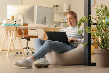 Sticker - Female programmer working with laptop in office