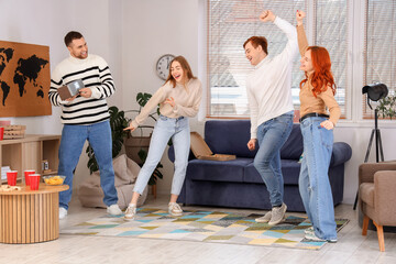 Canvas Print - Group of young friends with radio receiver dancing at home party