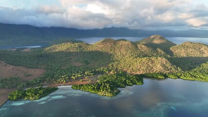 Poster - Morning sunlight illuminates the mangrove-fringed island of Lembata, Indonesia. This beautiful and biodiverse area is part of the famed Ring of Fire and is home to high marine biodiversity.