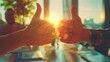 © Mnt - Thumbsup gestures in a collaborative office setting, sunlight filtering through windows, teamwork and positivity