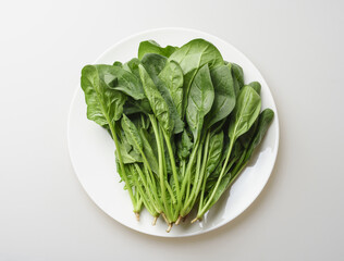 Poster - Close-up and top angle view of fresh spinachs with leaves and stems on a dish, South Korea
