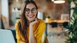 © Dzikrul Husnani - Image of young beautiful joyful woman smiling while working with laptop in office - generative ai