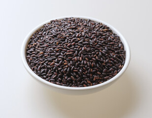 Poster - Close-up of stacked dried raw black rice on a dish, South Korea
