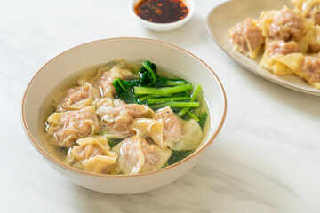 Wall Mural - pork wonton soup or pork dumplings soup with vegetable