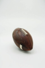 a football american ball, side view, white background.generative ai