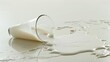 © KYR - A spilled glass of milk on the white floor, with the milk pooling around and emphasizing the mess.