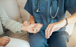 © Maass/peopleimages.com - Hands, nurse and check heart rate on wrist with patient for healthcare, wellness or high blood pressure. Watch, people or pulse for medical test, time or count beats for cardiology treatment in home