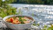 © Erik - Fish soup with a river in the background. Selective focus.