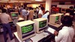 © PB Studio - Early Computer Lab Exploration Description: A vintage-style photo featuring a group of students huddled around desktop computers in a dimly lit computer lab. The monitors glow with green text,