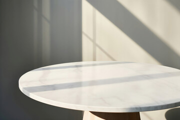 Poster - Empty round marble table with sunlight shadow on white wall background. Perfect for product placement or mockup templates