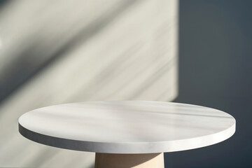 Aufkleber - Empty round white table top for product placement with sunlight shadow background