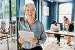 © peopleimages.com - Business, portrait and mature woman with tablet in office for schedule, networking or review proposal. Online, face and employee for website, feedback or survey at financial consulting agency