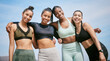 © Fanti/peopleimages.com - Exercise, portrait and woman friends on beach together for bonding, team building and unity. Fitness, hug and support with group of sports people outdoor on coast for physical training or workout